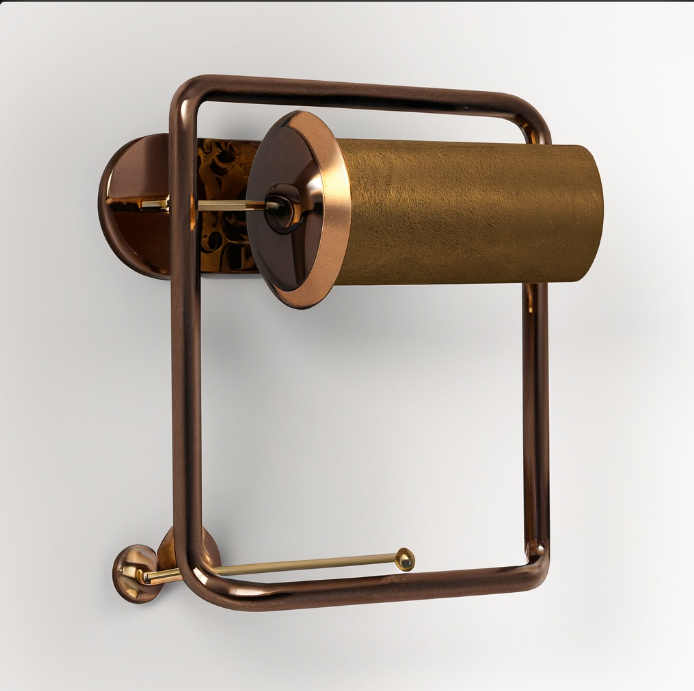 Bronze-colored toilet paper holder with a rectangular frame, mounted on a white wall.