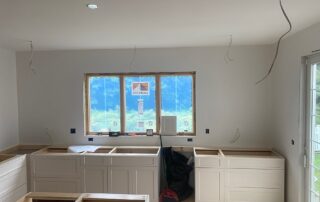 Image of kitchen remodel where cabinets have been installed without countertops
