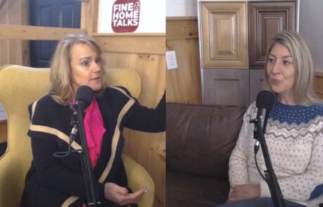Two women are seated and speaking into microphones, with a "Fine Home Talks" sign in the background.