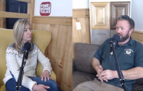 Two people are having a conversation in a recording studio with microphones. A sign behind them reads "Fine Home Talks.