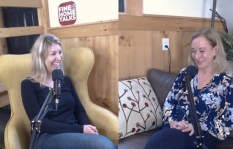 Two women are seated in a cozy, wooden room, engaged in a conversation with microphones. A sign reads "Fine Home Talks.