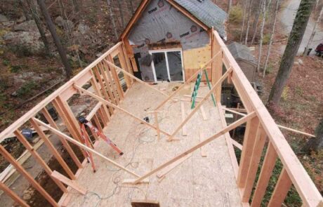 Framing crew constructs foundation for kitchen addition