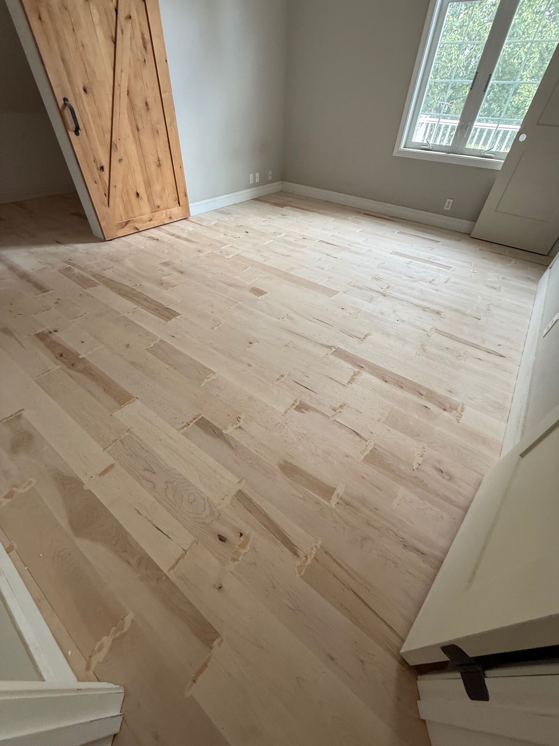Maple flooring refinishing in progress in a Connecticut home