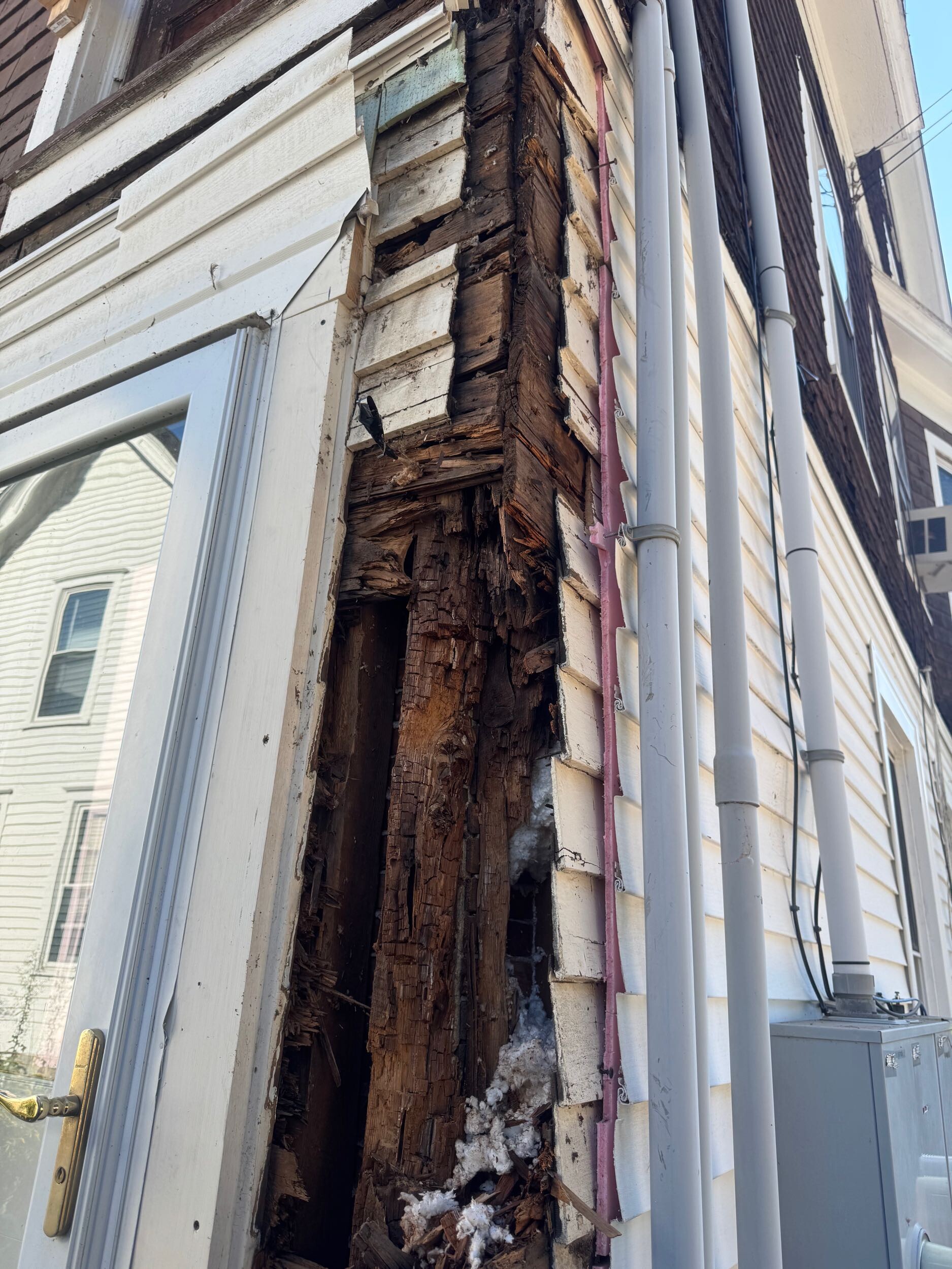 Severe concealed wood rot exposed at the corner of an older Connecticut home