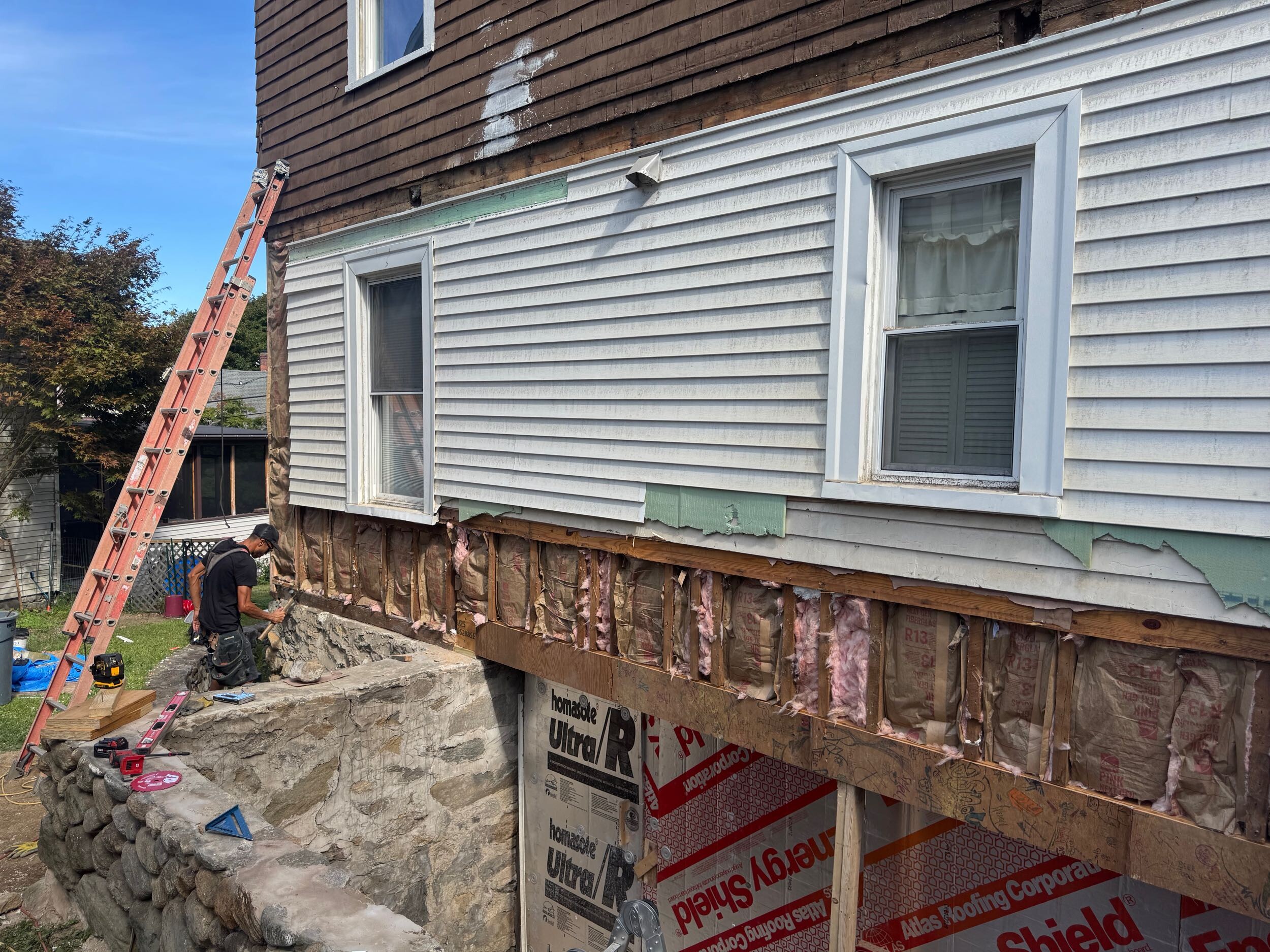 Wall opened during a Connecticut porch remodel to inspect concealed framing