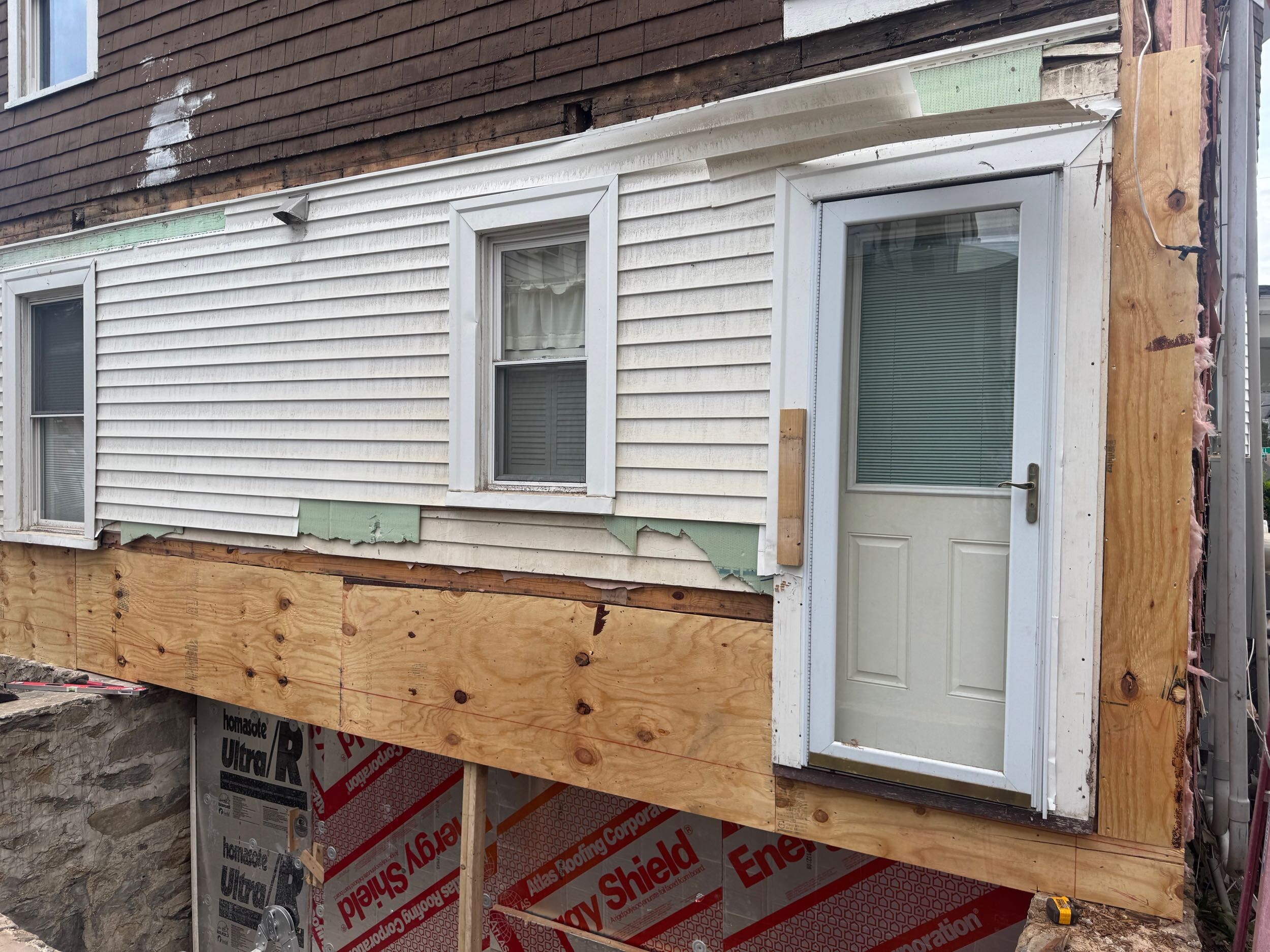 New structural sheathing installed after concealed rot repairs